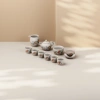 The celadon tea set includes a teapot, fair cup, tea cups, tea bowls, tea saucers, and an orange blossom branch painted beige gift box Application Scenario